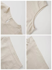 Beige V-neck sleeveless top and shorts set with textured fabric and ruched sleeve detail.