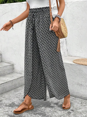 Black and white patterned palazzo pants with a drawstring waist and wide leg.
