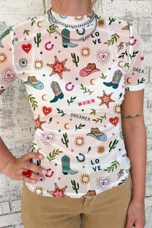 Women's white mesh tunic top with colorful cowboy boots, hats, and western print.