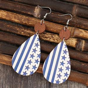 Patriotic print teardrop earrings with blue stripes and stars, featuring wooden accent.