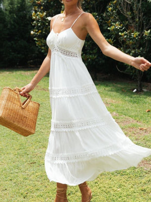 White lace trimmed tiered midi dress with spaghetti straps and a sweetheart neckline.