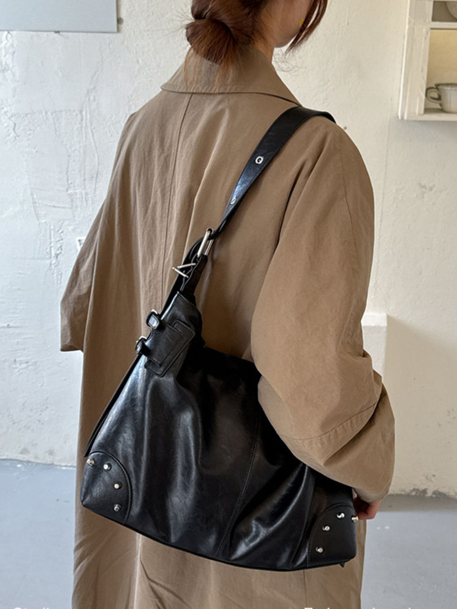 black with handbag with rivet decor