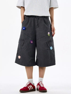 Dark Gray cotton cargo shorts with floral appliques and wide legs.