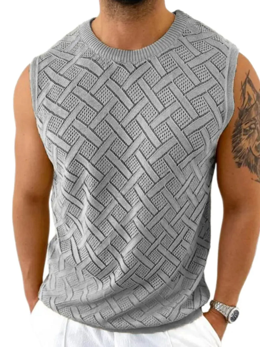 Gray knit sleeveless sweater with a geometric pattern and crew neck.