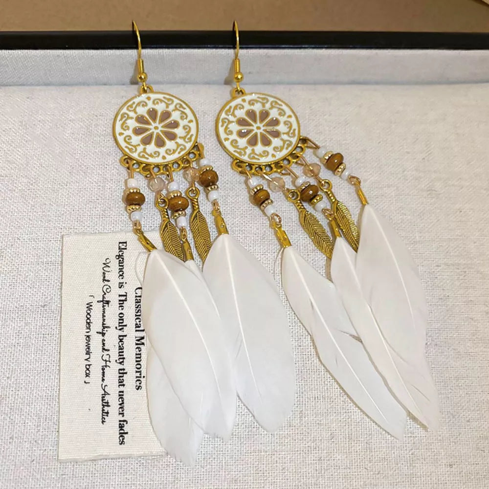 earrings in gold featuring feather accents and straight fit