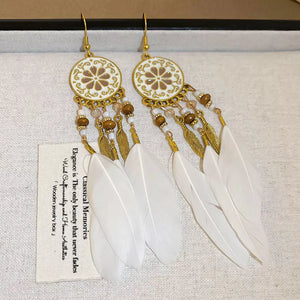 earrings in gold featuring feather accents and straight fit
