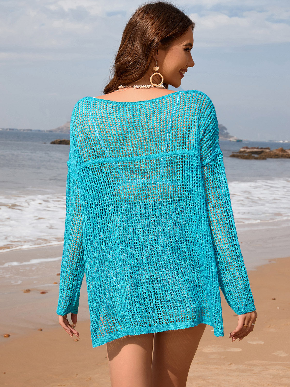 Aqua open-knit beach sweater with boat neck and long sleeves, acrylic.