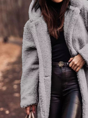 Gray teddy bear longline coat with hood, buttoned front, and pockets.