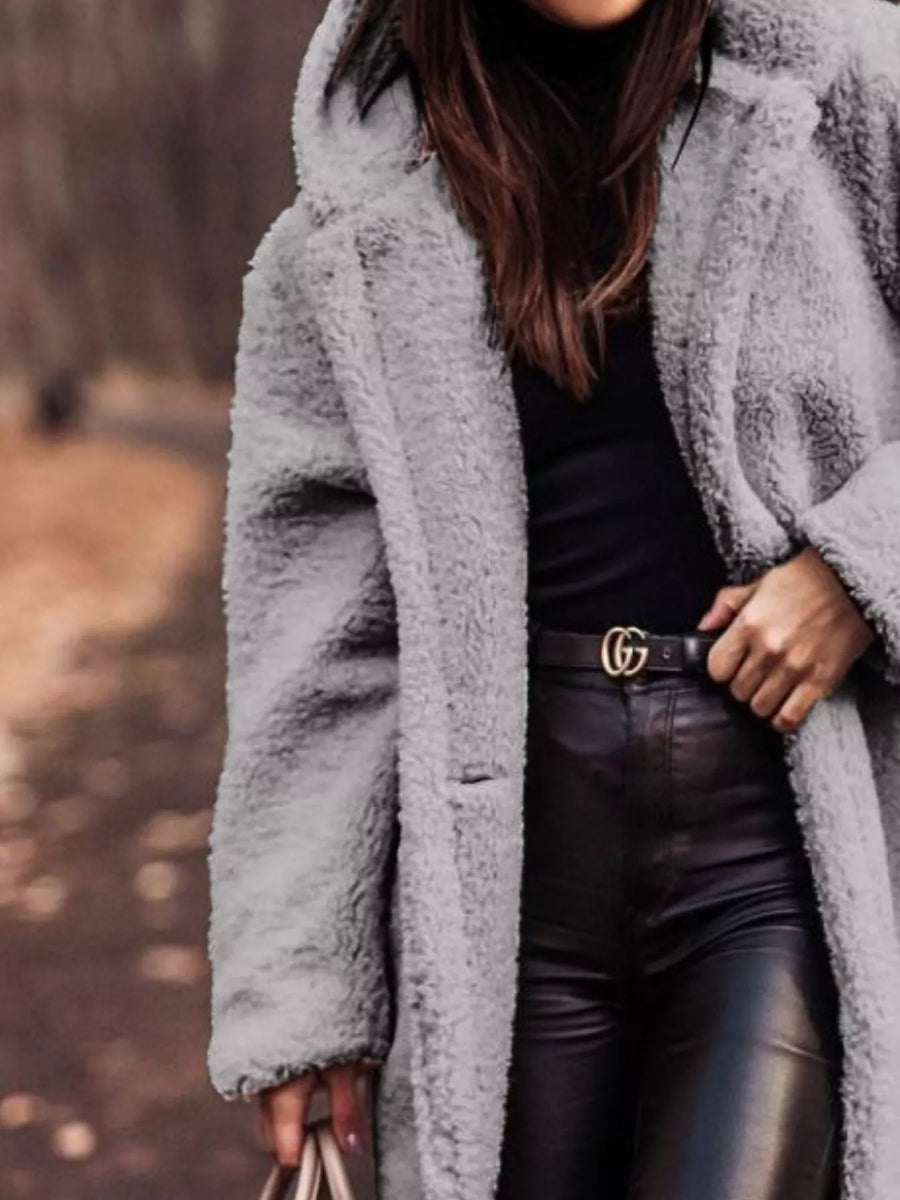 Gray teddy bear longline coat with hood, buttoned front, and pockets.