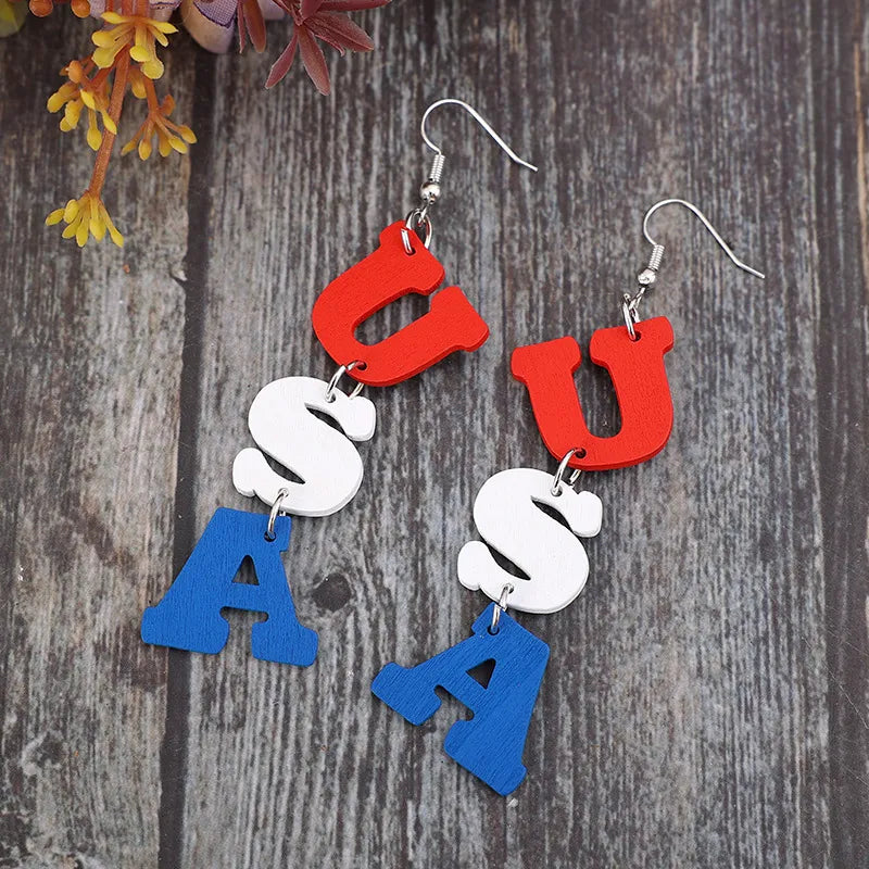 Patriotic USA letter drop earrings in red, white, and blue alloy.