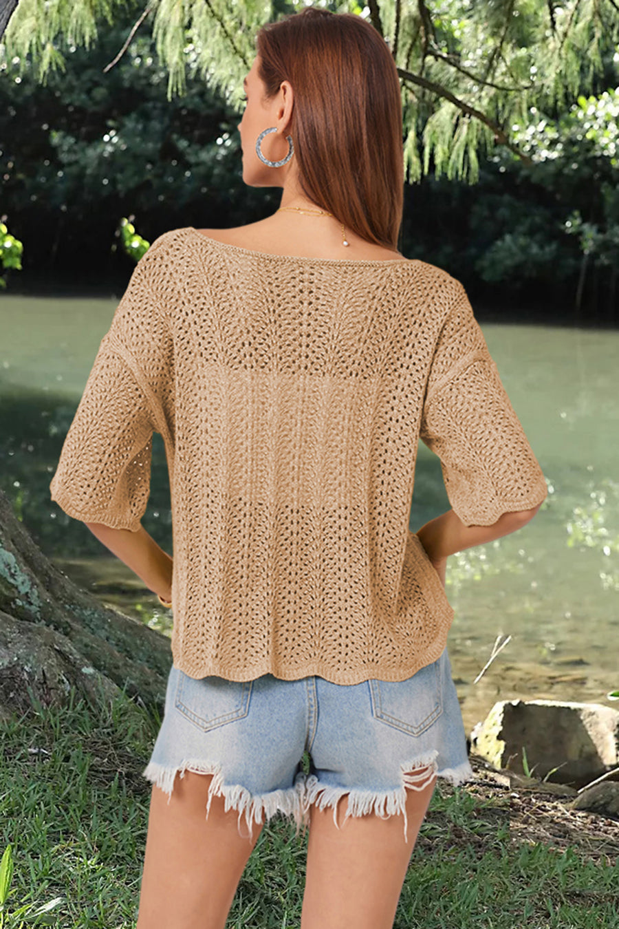 Khaki open-knit top with scalloped sleeves and a boatneck, styled with denim shorts.