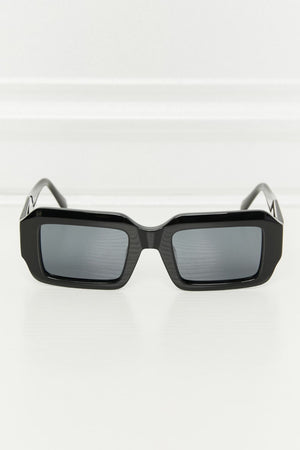 Black geometric frame polarized sunglasses with acetate material.