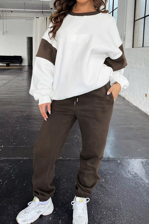 Contrast stitch oversized active set in chocolate and white, featuring a crewneck sweatshirt and drawstring sweatpants.