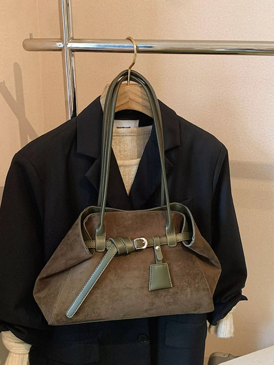 Brown suede shoulder bag with green trim and buckle detail