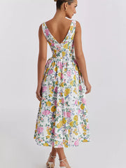 Floral print midi dress with V-neck and a-line skirt in white with pink and yellow roses.