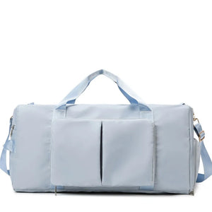 Light Blue Sport Luxe Weekend Holdall duffel bag with front pockets and adjustable strap.