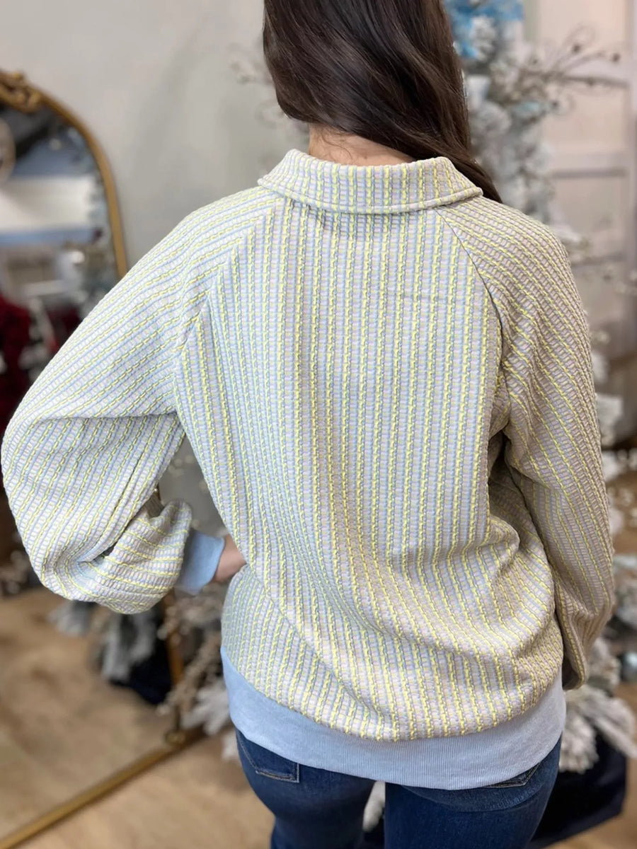 Buttoned Half Snap Sweatshirt in light green with a textured stripe pattern and collared neckline.
