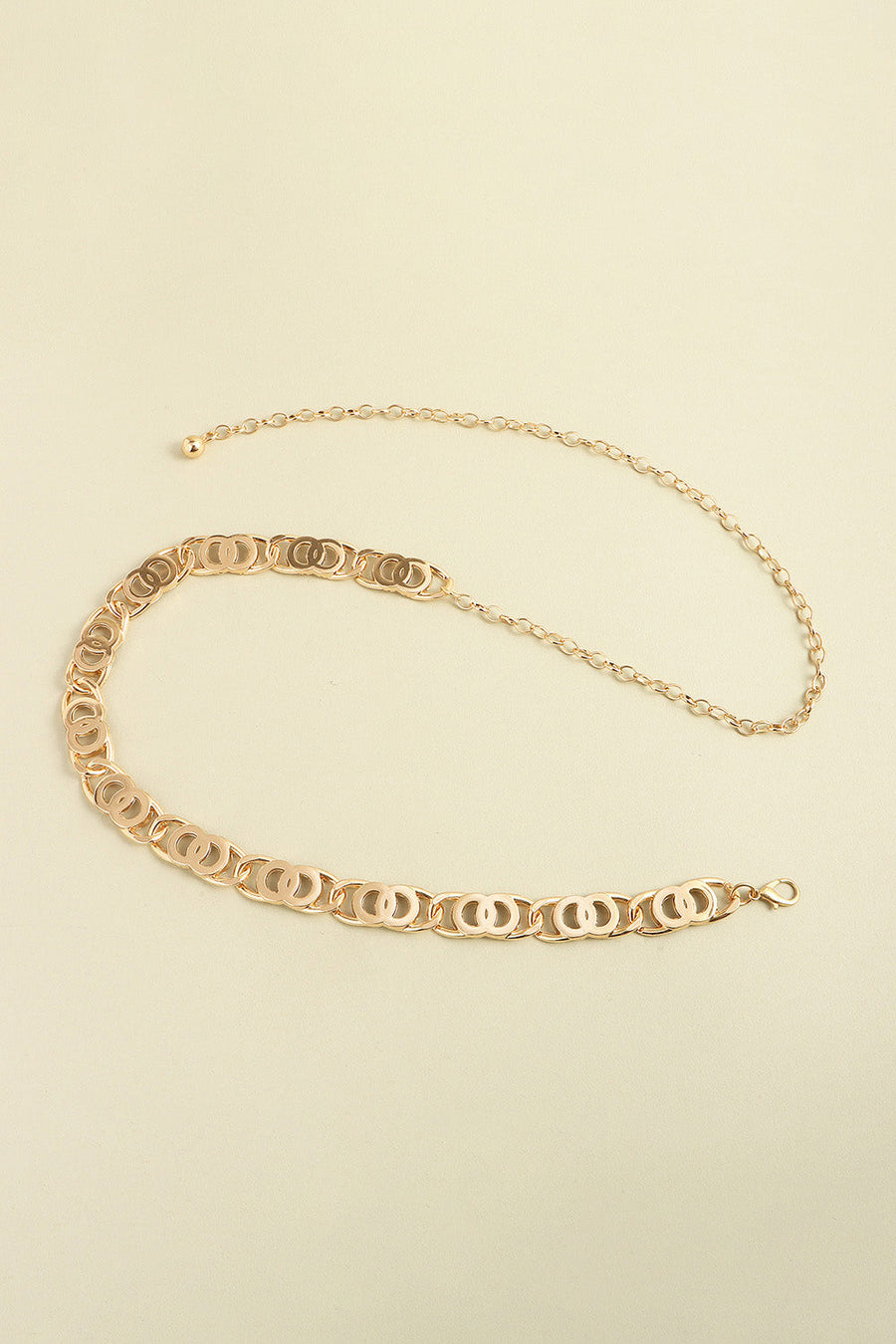 Golden circle chain belt with adjustable clasp and extender chain.