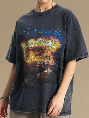 Black oversized graphic tee with vintage circus design and distressed details.