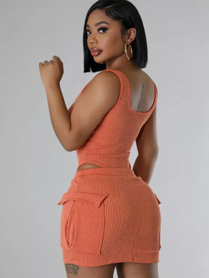 Orange ribbed knit crop top and cargo mini skirt set with scoop neck and tank straps.