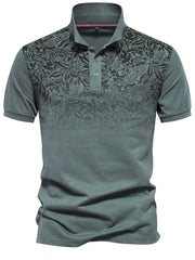 Floral ombre polo shirt with short sleeves and a buttoned collar in a grey-green hue.