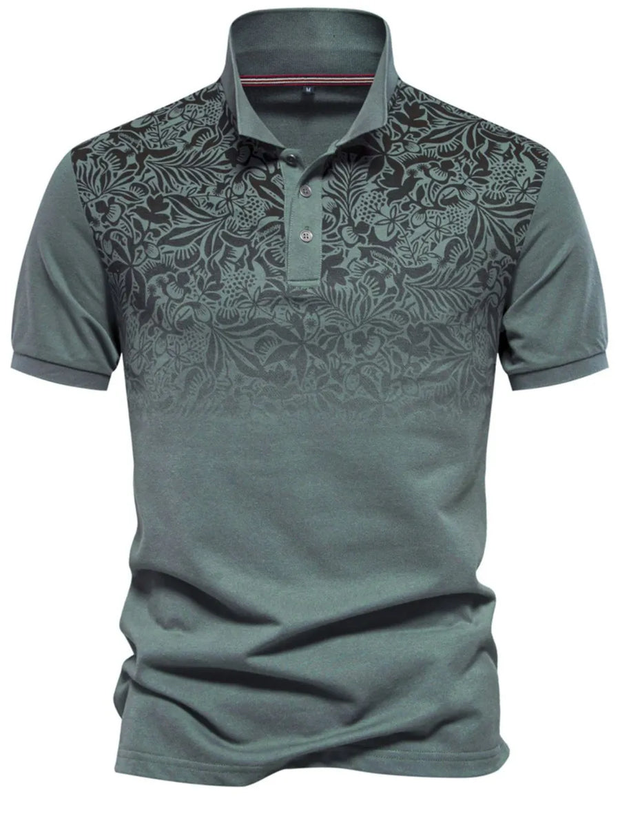 Floral ombre polo shirt with short sleeves and a buttoned collar in a grey-green hue.