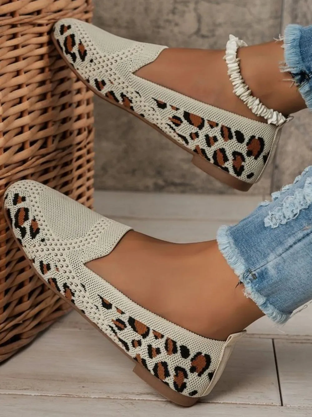 Knit ballet flats in beige with leopard print accents and a V-cut vamp.
