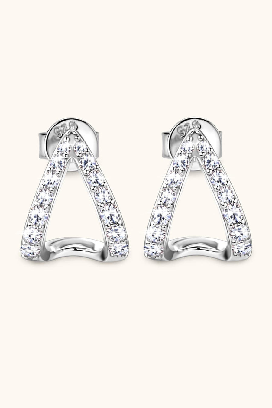 Silver geometric moissanite open-hoop earrings with pavé-set stones.