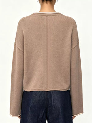 50% Viscose, 28% Polyester, 22% Polyamide Care instructions: Machine wash cold crewneck sweater in Apricot with relaxed