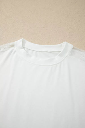 White long sleeve shirt with crew neck and delicate lace shoulder detail