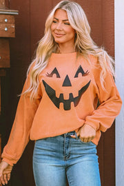 Caramel corduroy sweatshirt with jack-o'-lantern graphic and long sleeves.