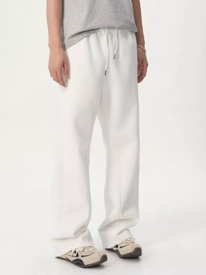 White relaxed fit sweatpants with adjustable drawstring waist
