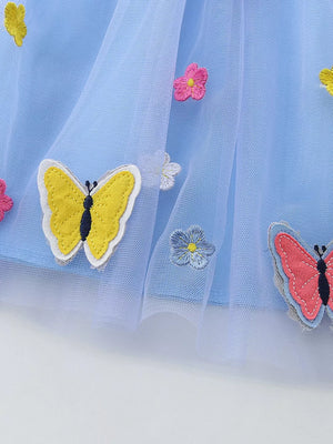 Baby blue tulle dress with embroidered butterflies and flowers.