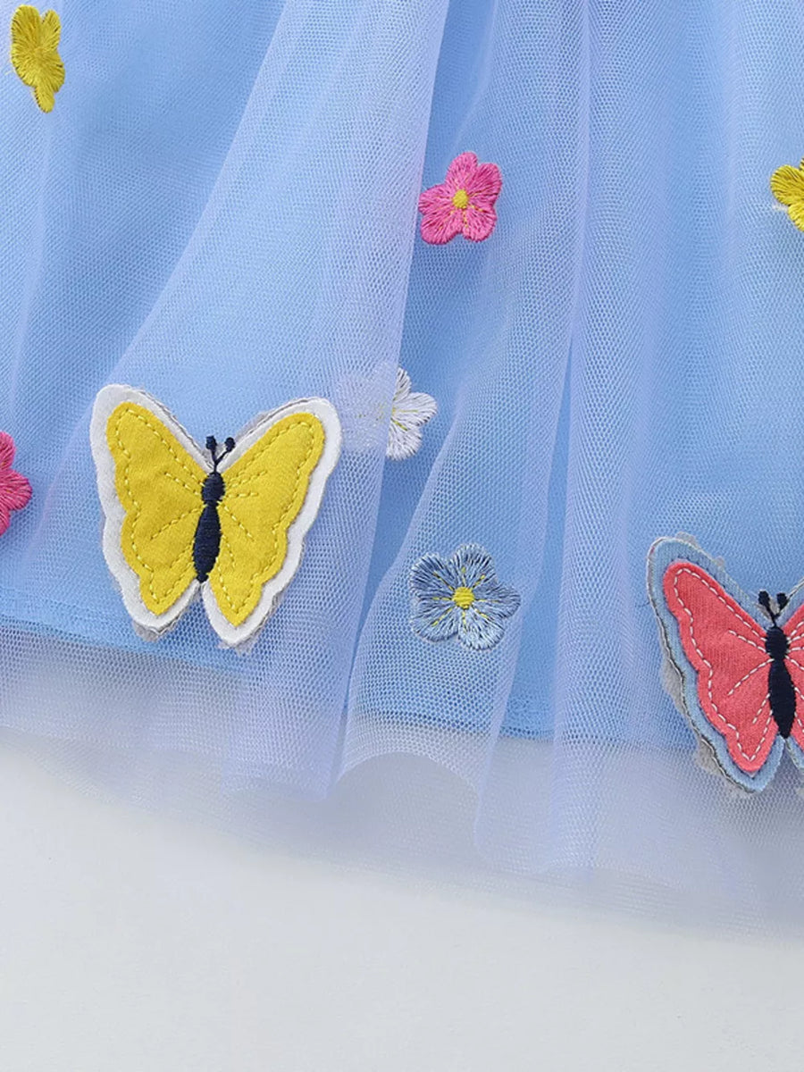 Baby blue tulle dress with embroidered butterflies and flowers.