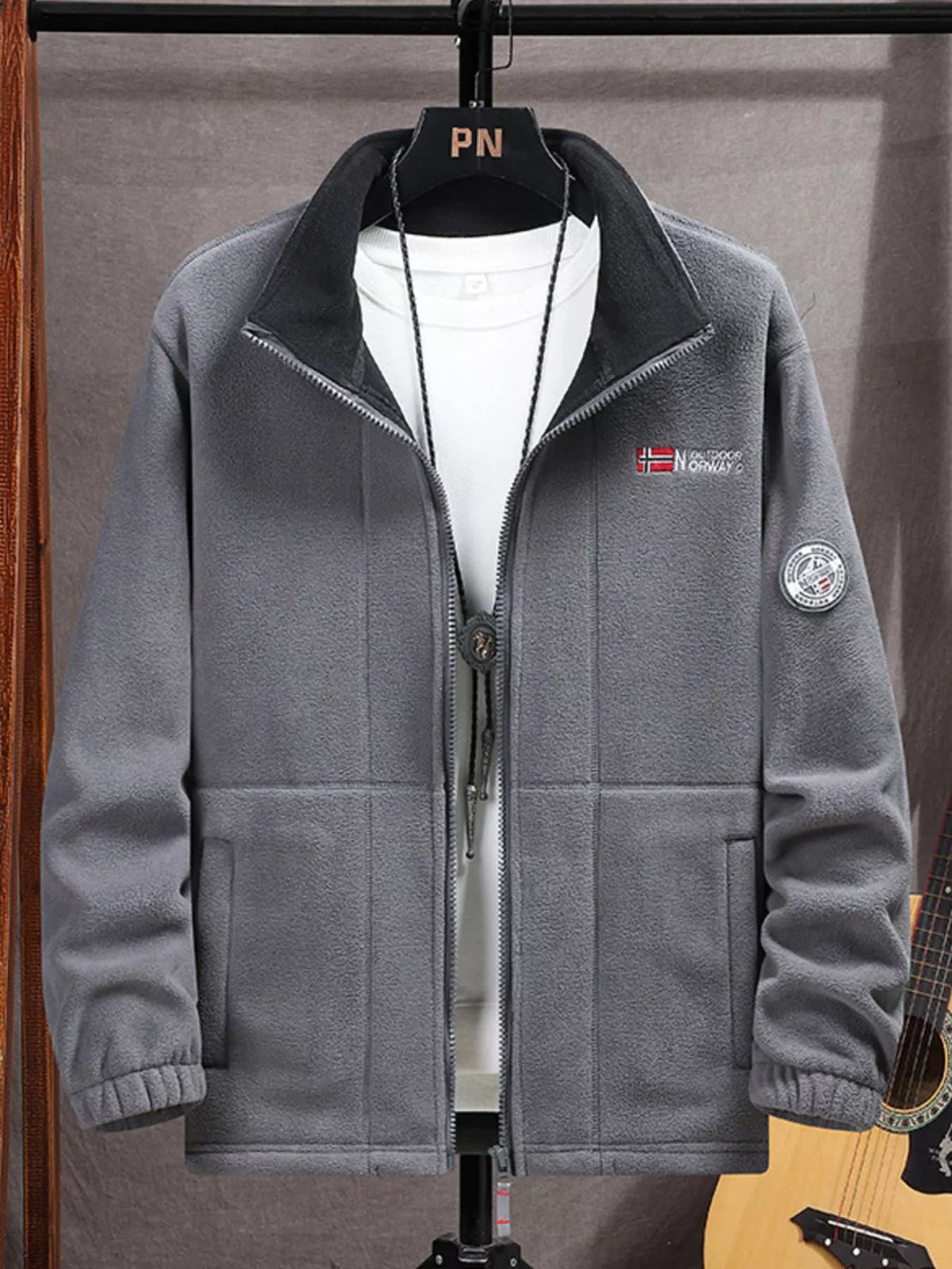 Men's grey fleece zip-up jacket with black collar and Norway patch detail.