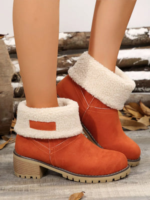 Orange suede ankle boots with sherpa trim and block heel