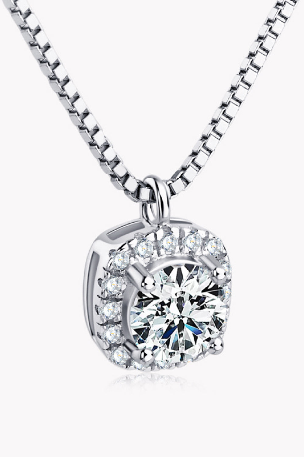 Silver halo diamond pendant necklace with a round-cut center stone and cubic zirconia accents.
