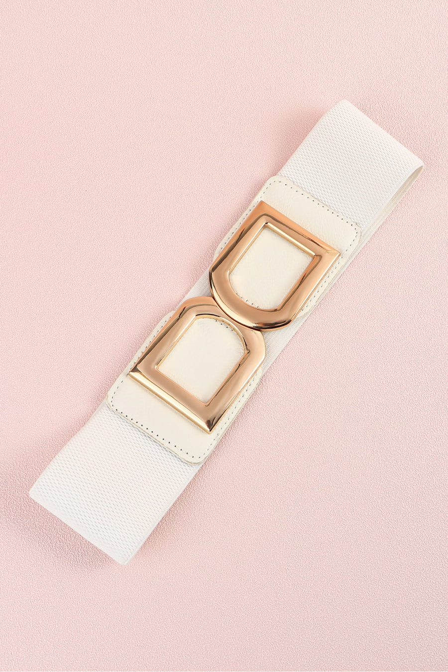 White elastic belt with double gold D-ring buckles and faux leather accents.