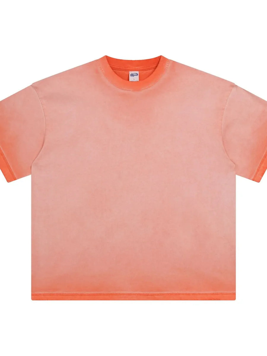 Pigment-dyed oversized tee in Burnt Coral with a faded effect, crew neck, and short sleeves.