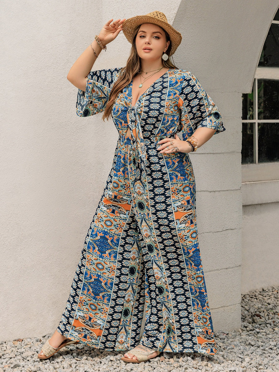 Bohemian palazzo jumpsuit in Peacock Blue with tie-front, V-neck, and bell sleeves.