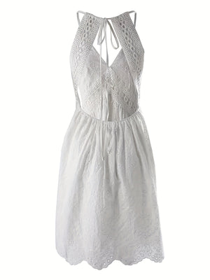 White eyelet lace V-neck mini dress with cutout back and tie detail.