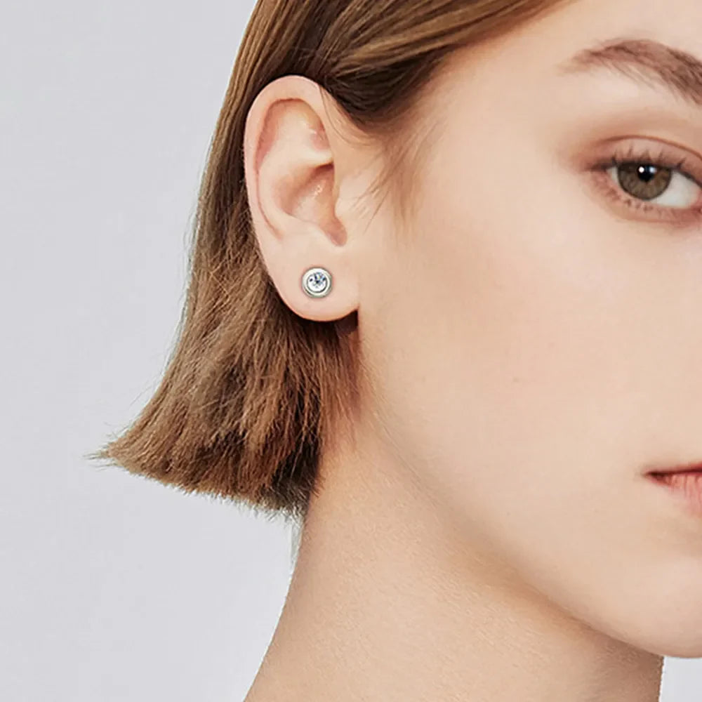 Silver bezel-set crystal stud earrings with a bright, D color grade stone.