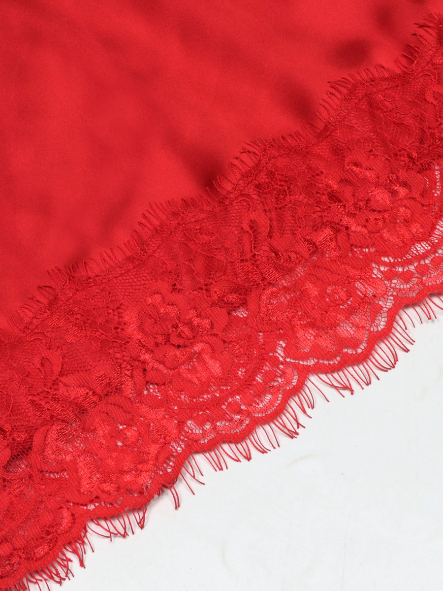 Red satin cami top with delicate lace trim detail.