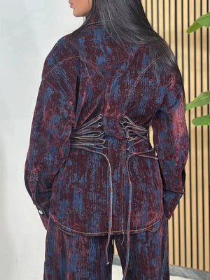 Burgundy denim jacket and pants set with lace-up back detail and distressed pattern