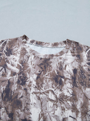 Woodland camouflage tunic with crew neck and drop shoulders.