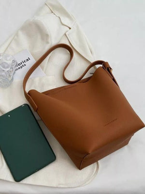 Brown minimalist PU leather shoulder bag with subtle embossed logo