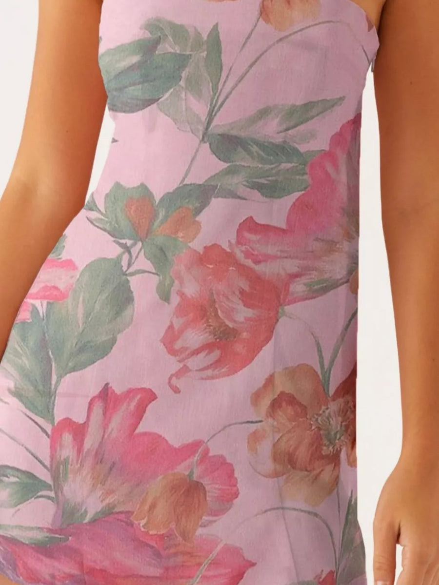 Strapless mini dress in blush pink with a watercolor floral print.