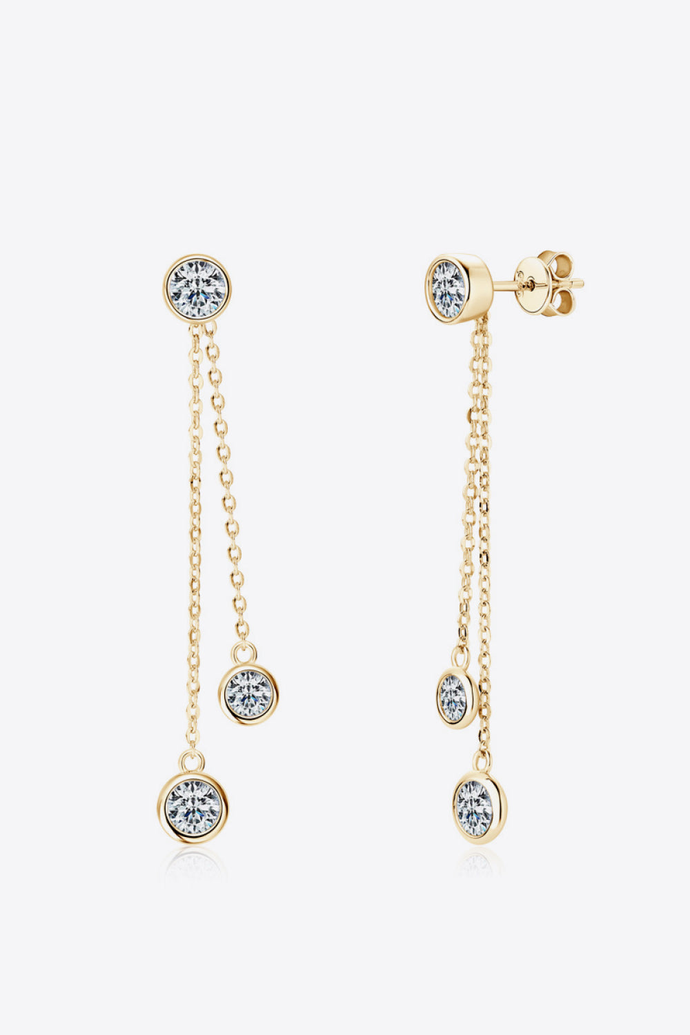 Gold cascade diamond drop earrings with three bezel-set cubic zirconia stones.