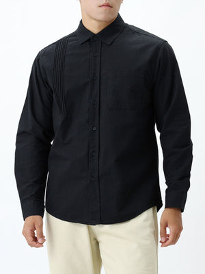 Black button-up shirt with hip-length and button-front