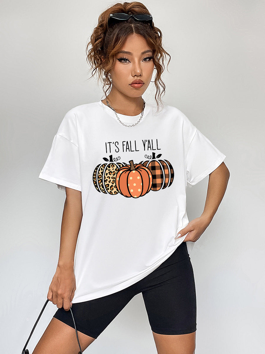 White graphic tee with pumpkins and "IT'S FALL Y'ALL" text